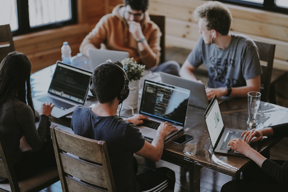 Team members collaborating together at a table